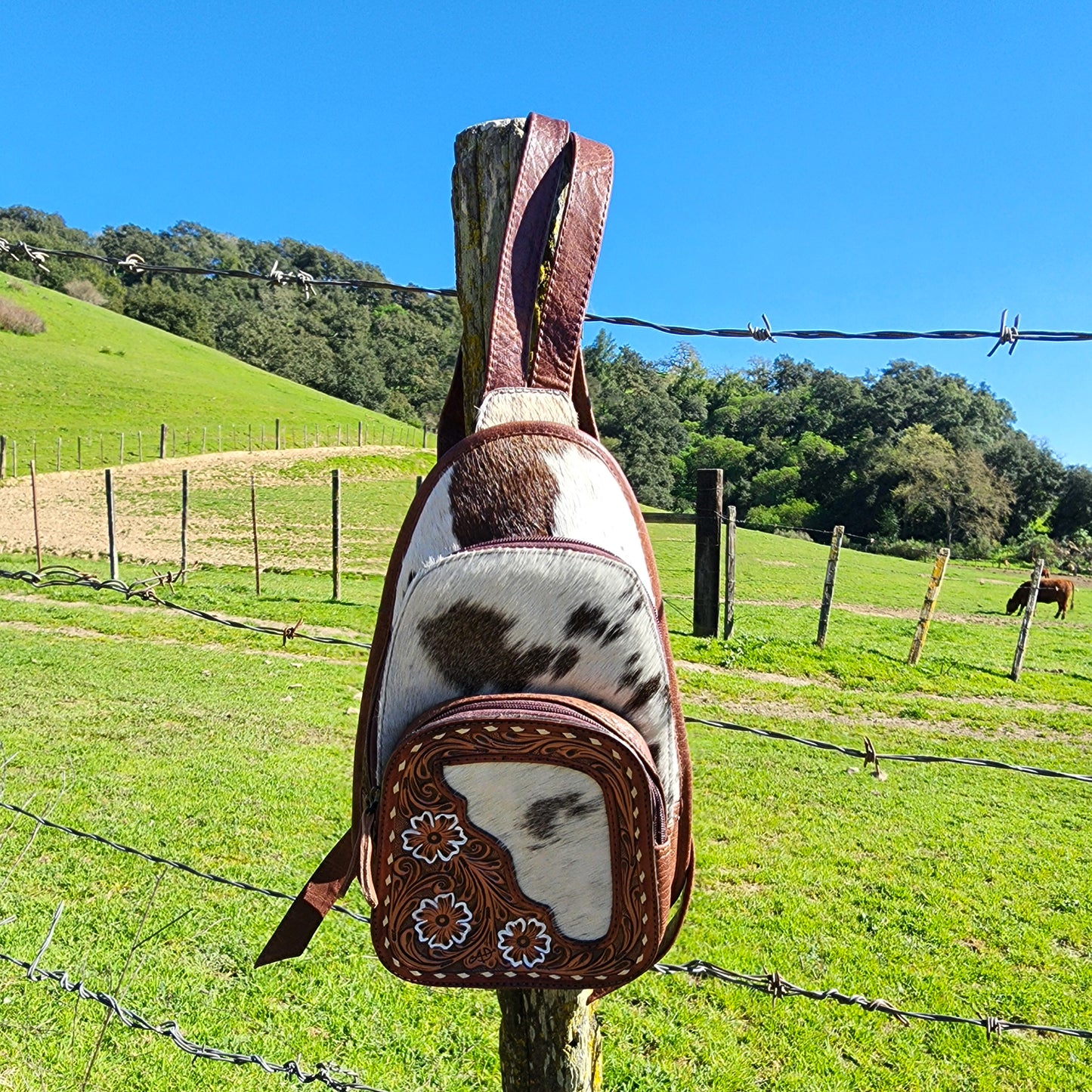 The Trisha Cowhide Sling Backpack